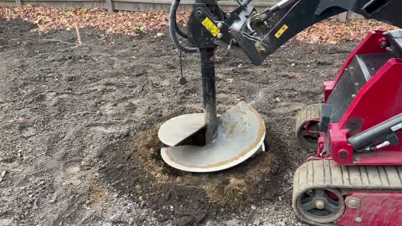 Auger drilling into the ground on a Tampa well site